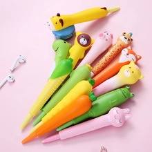 Detail shot of assorted novelty pens shaped like animals and vegetables on pink background