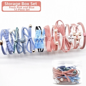 Detailed view of 12-piece pink and blue elastic hair ties with pearls and storage box