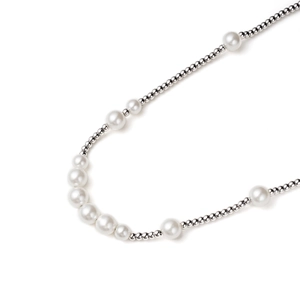 Detailed macro view showing the elegant mix of white pearls and silver metal beads