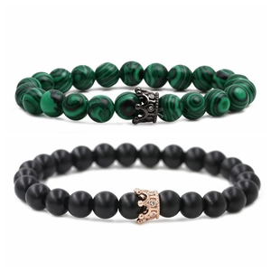 Malachite and matte black beaded stretch bracelets with pavé crown charms for couples