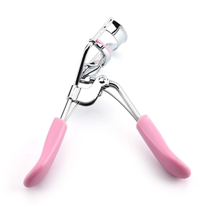Professional silver eyelash curler with pink plastic handle and silicone pad on white back