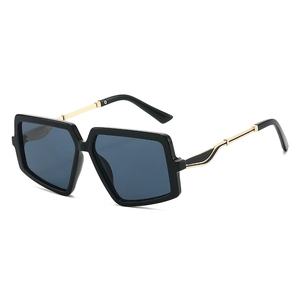 Modern oversized square sunglasses for women with black thick frames and gold metal temples