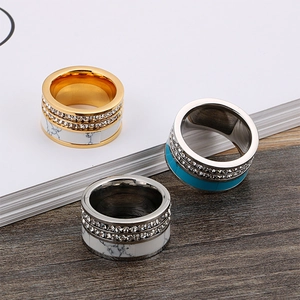 Modern stainless steel rings featuring turquoise accents and double-row crystal inlays