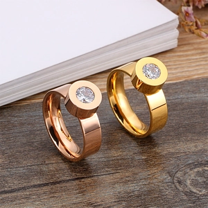 Minimalist titanium steel rings in gold and rose gold with bezel-set round zircon