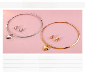 Detailed close-up of polished heart pendant necklace and matching stud earrings set