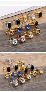 Macro detail of stainless steel rings with large zircon stones and hollow double-band design