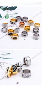 Macro detail of various stainless steel rings with rhinestones in gold and silver finishes