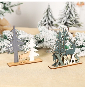 Detail of DIY wooden Christmas ornaments with hollow XMAS text and festive elk motifs
