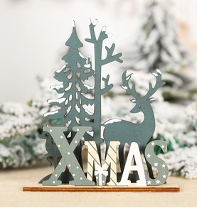 Detail of wooden Christmas desktop decor with reindeer, tree and XMAS lettering