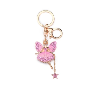Rose gold flower fairy keychain with pink crystals and star pendant on white background