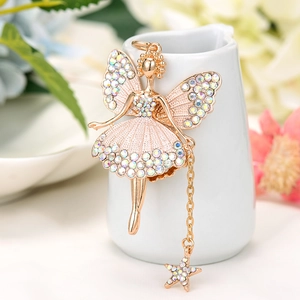 Close-up of golden fairy keychain with colorful rhinestones and a star pendant
