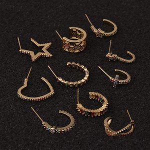 Detailed set of 11 bohemian gold-tone star and heart stud earrings with colorful zircons