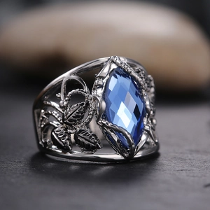 Vintage silver ring with a large marquise cut blue crystal and leaf detail