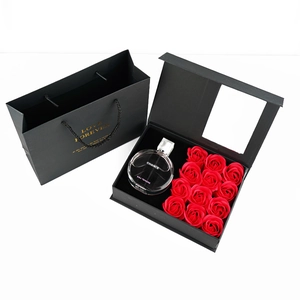 Valentine's Day gift set with 12 red soap roses and a round perfume bottle in a black box