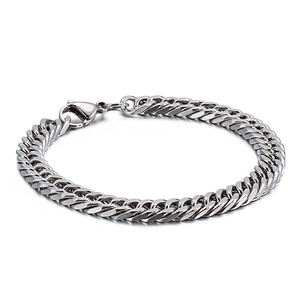 Polished silver stainless steel Cuban link bracelet with lobster clasp on white background