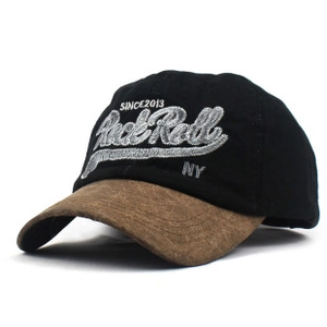 Detail shot of cotton baseball cap with NY embroidery and brown visor contrast