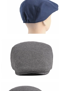 Detail view of navy blue and grey knit beret hats showing texture and fit