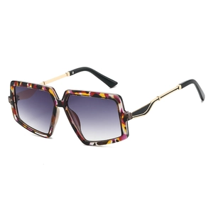 Fashionable large square sunglasses with colorful abstract frame and purple gradient lenses