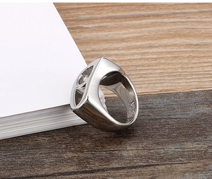Detailed side view of silver titanium steel ring featuring hollow-out craftsmanship