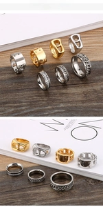 Macro detail of industrial style titanium steel chain rings and engraved minimalist bands