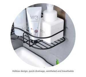 Detail of black iron corner shelf holding toiletries with a hollow drainage design