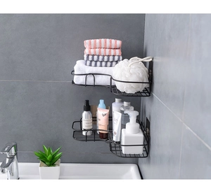 Modern double-tier black metal corner shelf mounted on grey bathroom tiles