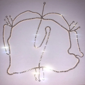 Detailed macro view of the shimmering rhinestone tassel chains for bridal hair accessories