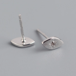 Detailed close-up of S925 sterling silver eye-shaped stud earrings with starburst engraving