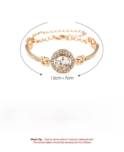 Detail view of 10.3g rose gold bangle with round crystal and heart-shaped hollow design