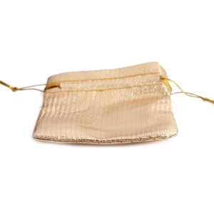 Golden metallic drawstring pouch for jewelry and small gifts with textured fabric
