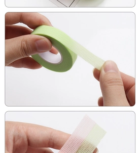 Close-up of breathable microporous mesh tape for eyelash extension in pink and green