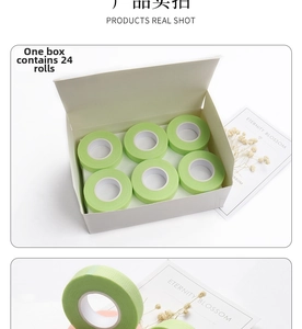 Macro shot of breathable light green non-woven lash extension tape in a 24-pack box