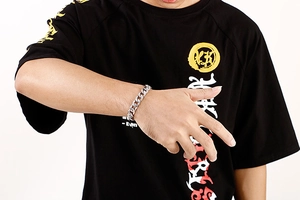 Silver cuban link bracelet in stainless steel on wrist showing urban street fashion style