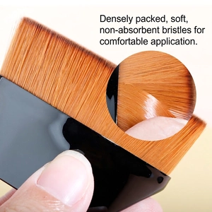 55 petal-shaped foundation brush with dense orange synthetic bristles and black handle