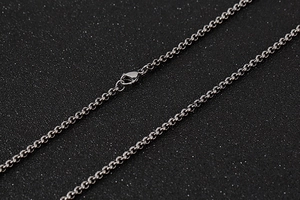 Close-up of silver stainless steel O-chain necklace showing details of the lobster clasp