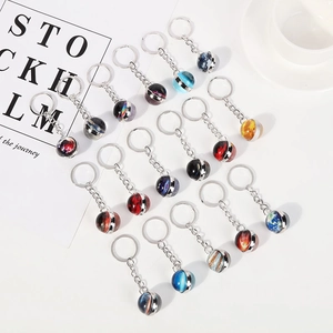 Solar system double-sided glass ball keychains featuring planets like Earth and Mars