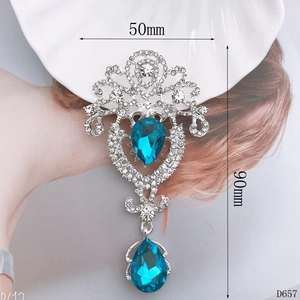 Detailed view of silver flower pendant with blue gems and 90mm height dimensions