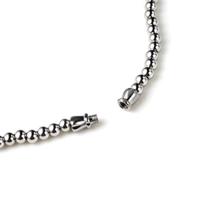 Macro detail of silver stainless steel ball chain featuring a threaded screw clasp closure