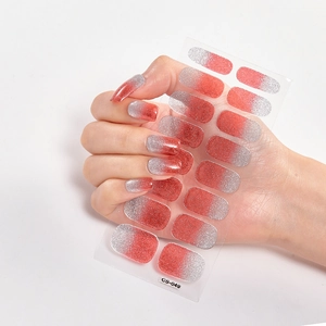 Sparkly red and silver gradient glitter nail art stickers applied on fingernails