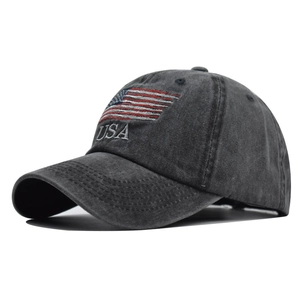 Close-up of vintage washed cotton baseball cap featuring embroidered USA flag and text