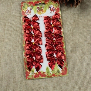 Set of 12 red metallic Christmas tree bow decorations on card packaging