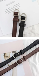 Detailed view of black and brown slim belts with matte silver D-ring buckles on magazines