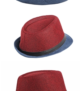 Detail of tricolor Fedora hat with red woven crown blue brim and black decorative band