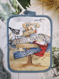 Thick cotton pot holder featuring a blue nautical beach print with hanging loop detail