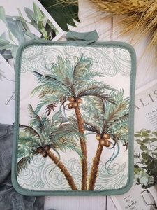 Close-up of tropical palm tree print on thick cotton heat-resistant baking mat with hanging loop