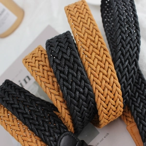 Braided wax cord belt with round buckle in black and mustard yellow, woven texture detail