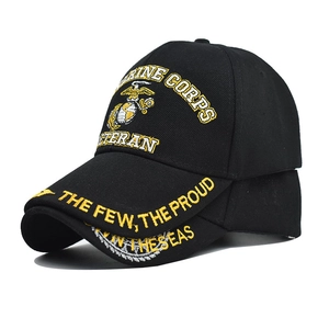 Macro detail of high-quality golden USMC Veteran embroidery on a black tactical baseball cap