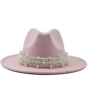 Elegant pink wool fedora hat for women with luxury pearl band decoration in soft lighting