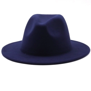 Detailed top view of a dark blue wool felt fedora hat featuring a wide brim and creased crown
