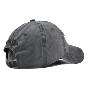 Close-up of washed cotton baseball cap with vintage finish and metal buckle strap
